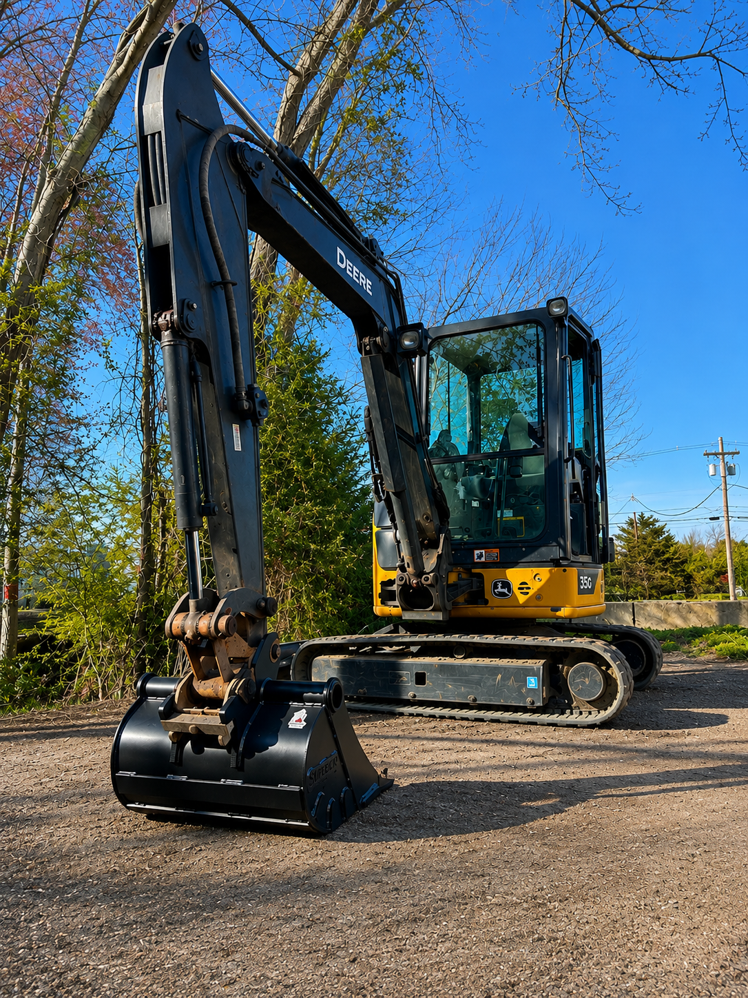 Compact excavator bucket and attachment page