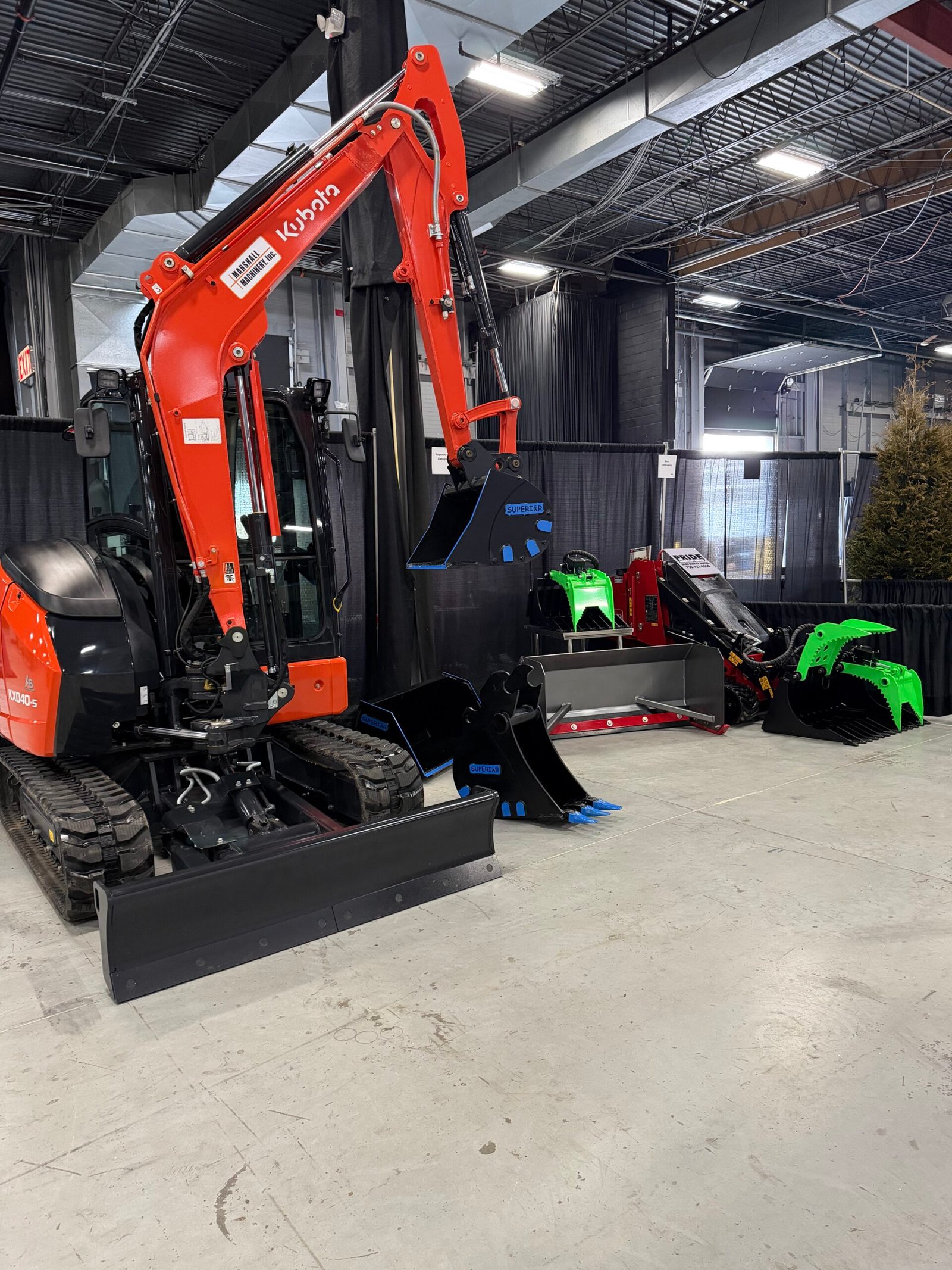 Kubota compact excavator fitted with a wide cleanup bucket